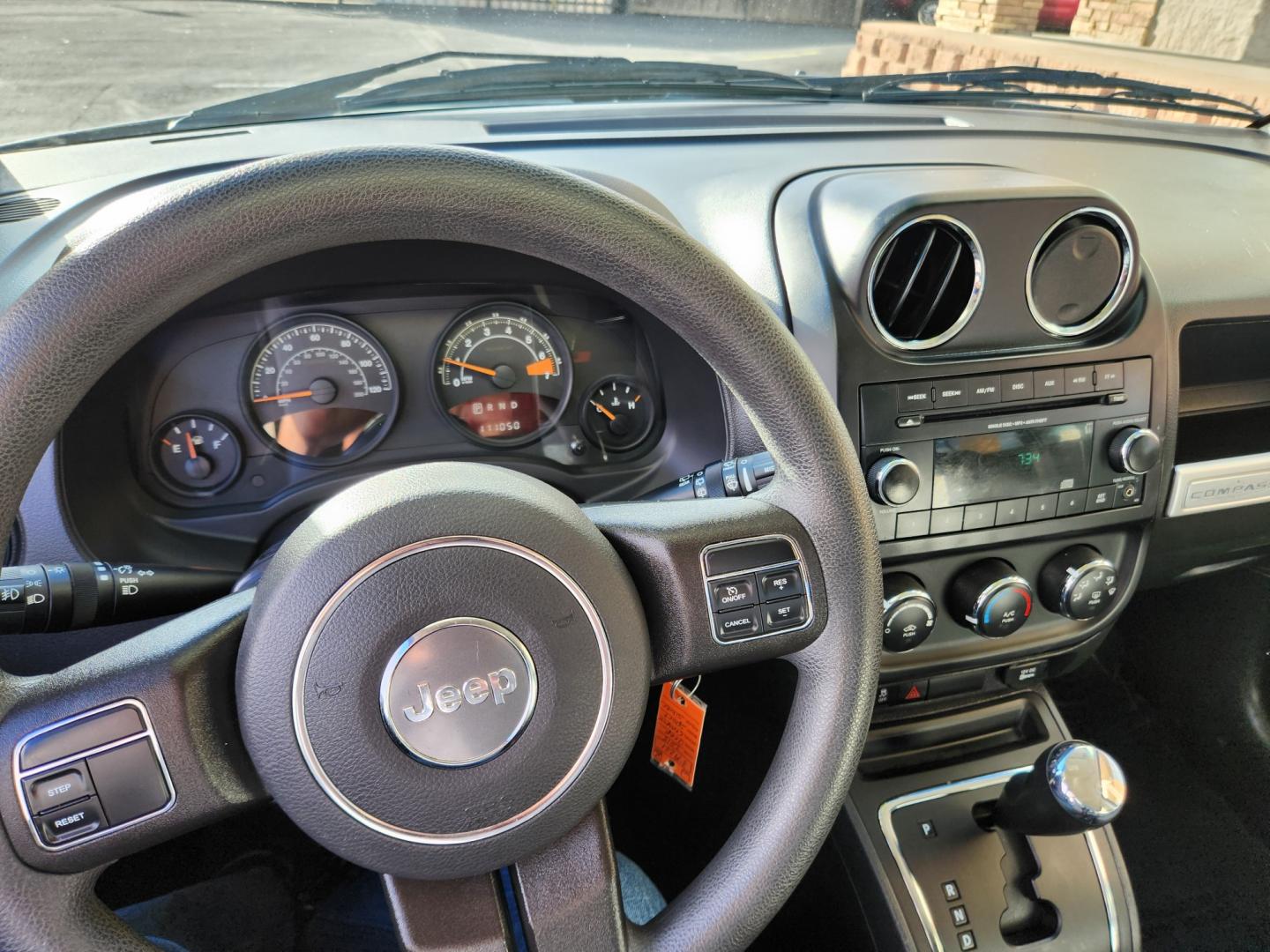 2015 Billet Silver Metallic Clearcoat /Dark Slate Gray Jeep Compass Sport (1C4NJDBB9FD) with an 2.4L I4 DOHC 16V Dual VVT engine, Automatic transmission, located at 10890 W. Colfax Ave., Lakewood, CO, 80215, (303) 274-7692, 39.739914, -105.120132 - 2015 Jeep Compass<br><br>D1 Auto NEVER charges dealer fees! All cars have clean titles and have been inspected for mechanical issues. We have financing for everyone. Good credit, bad credit, first time buyers.<br><br>Please call Lakewood Location 303-274-7692 or Thornton 303-287-5511 to schedule a t - Photo#8